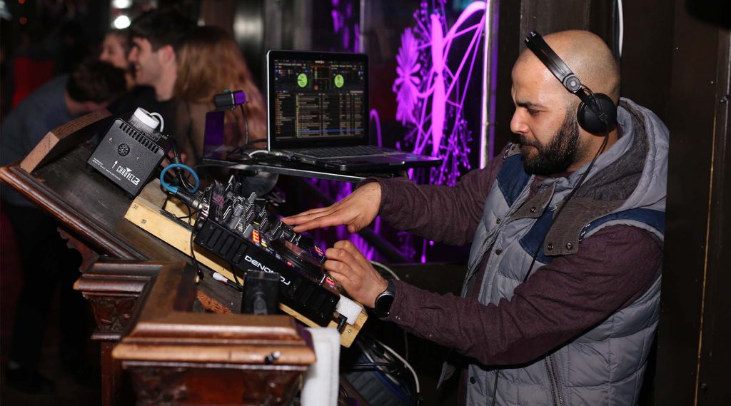 Gallery: The Ultimate Wedding DJ | Headphones are necessary for the DJ