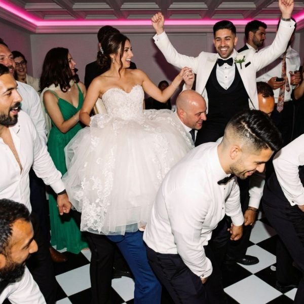 wedding-dj-hora-packed-dance-floor-checkered-floor